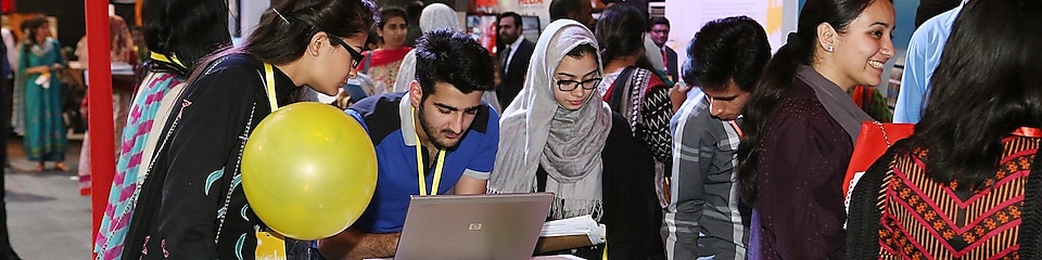 people looking at laptop